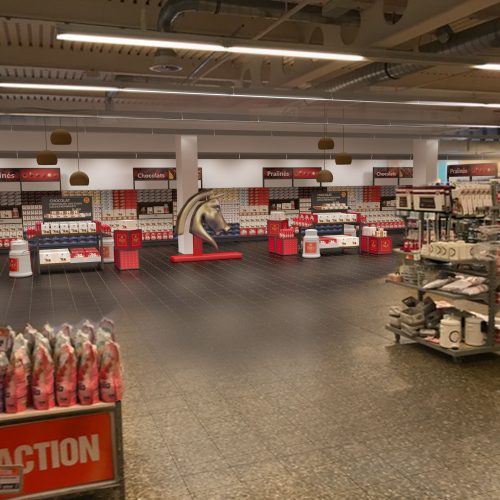 3D Visualisierung einer größeren Regalfläche von Frey Schokolade innerhalb von einem Supermarkt.